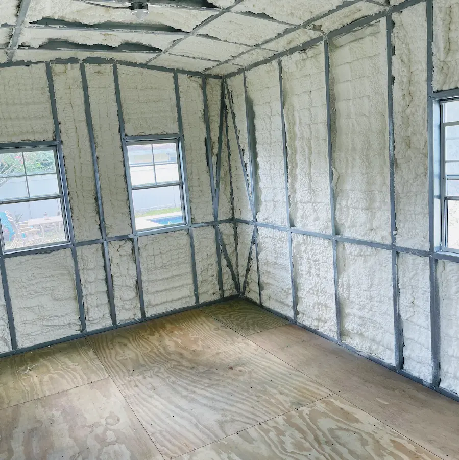 Closed-cell spray foam insulation applied to wall cavities in a residential project in Logan